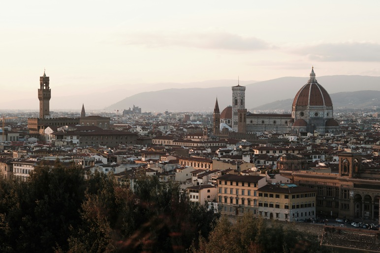 Sunset over historic Italian rooftops, bespoke cultural travel in Europe