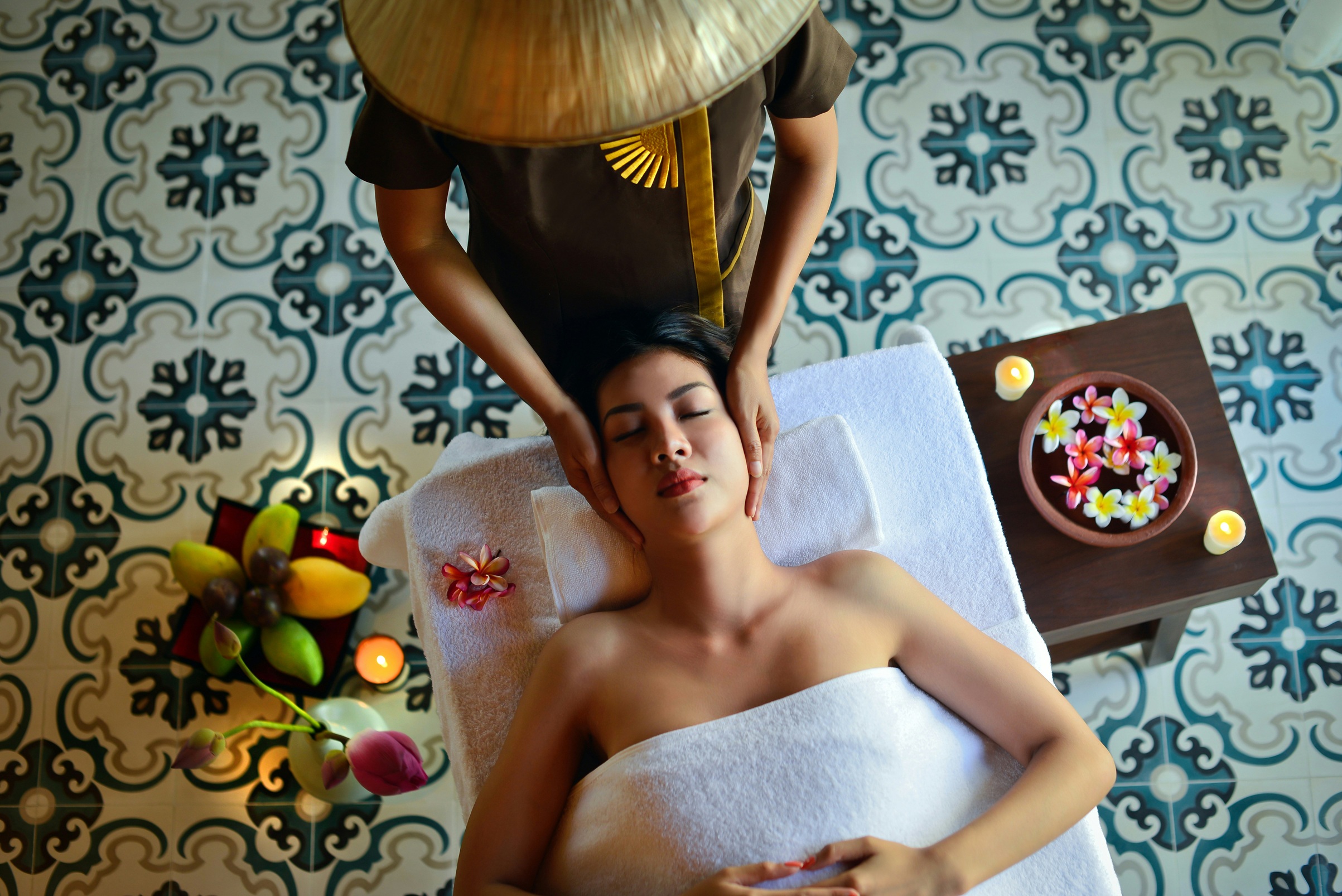 Private wellness experience — traditional massage in an elegant spa setting